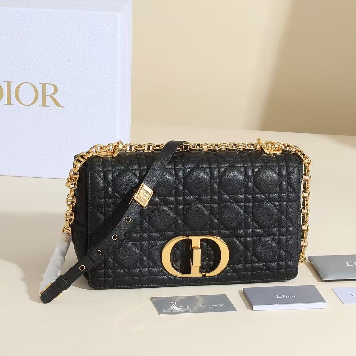 Dior Medium Caro Bag in black supple Cannage calfskin.