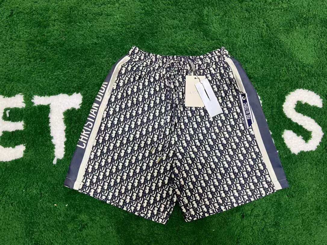 Dior Monogram Logo Side Striped Shorts in navy oblique pattern.