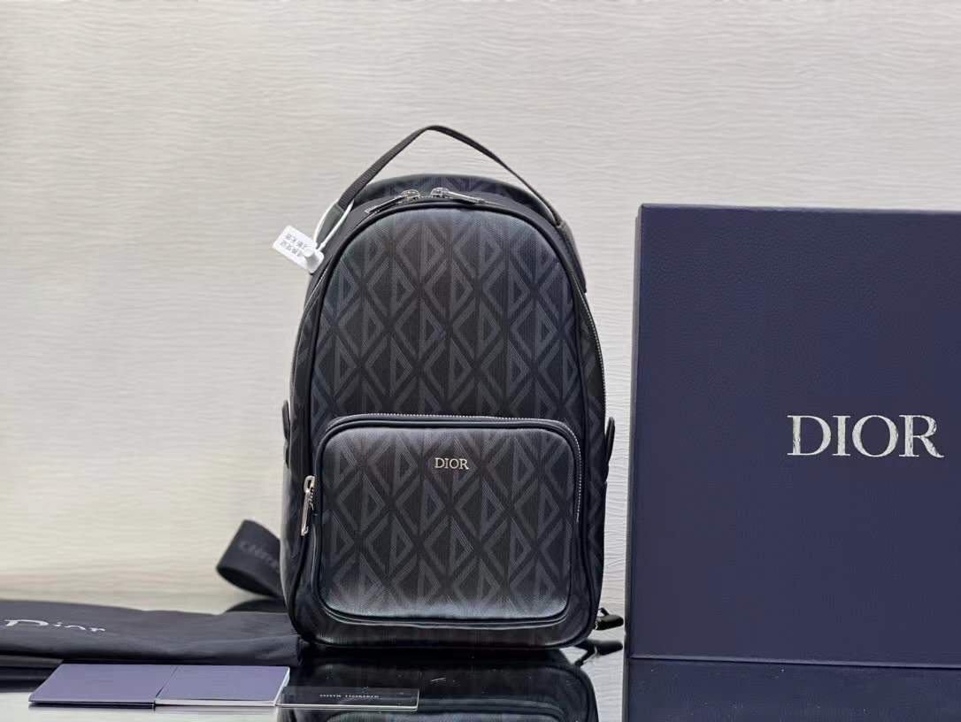 Christian Dior CD Diamond Mini Rider Backpack in black coated canvas and calfskin leather trim.