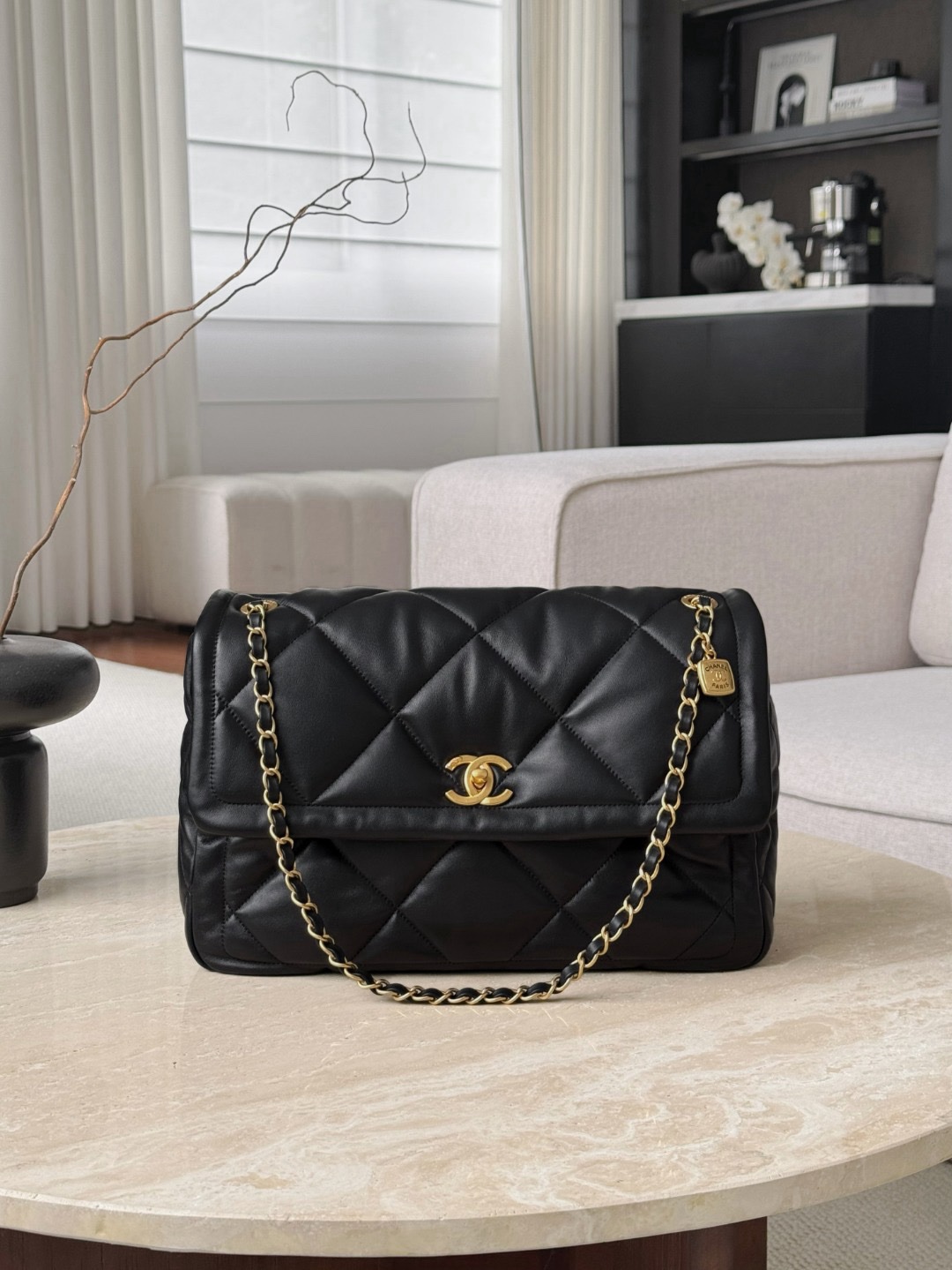 Chanel 19 handbag in black shiny lambskin leather with gold-tone, silver-tone, and ruthenium-finish metal hardware Size 24x35x10cm