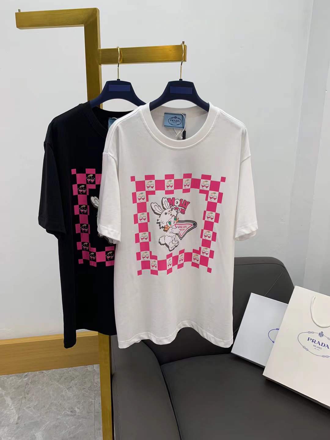 prada white oversized graphic t-shirt with a pink checkered border and a rabbit graphic