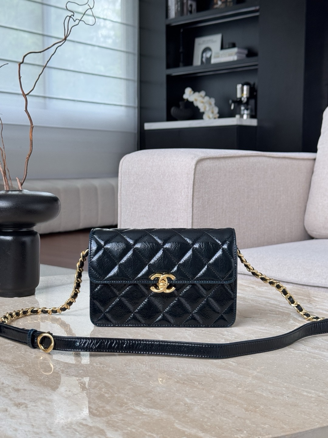 Chanel Classic Flap Handbag in black quilted leather with gold-tone hardware Size 12×19.5x5cm