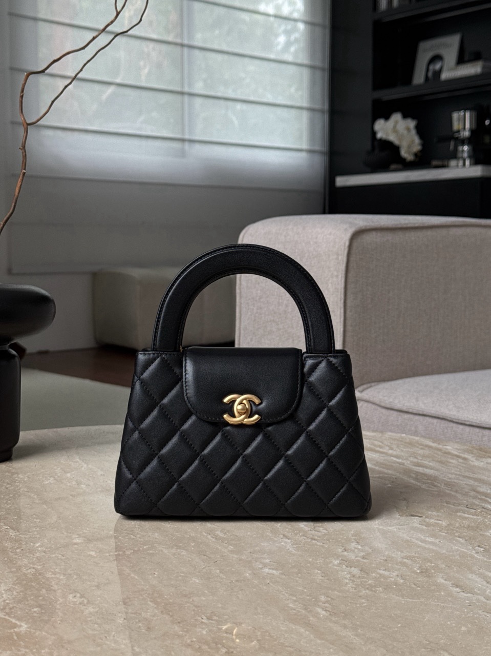 Chanel Small Kelly Re-Edition handbag in black lambskin with gold hardware Size 13x19x7cm