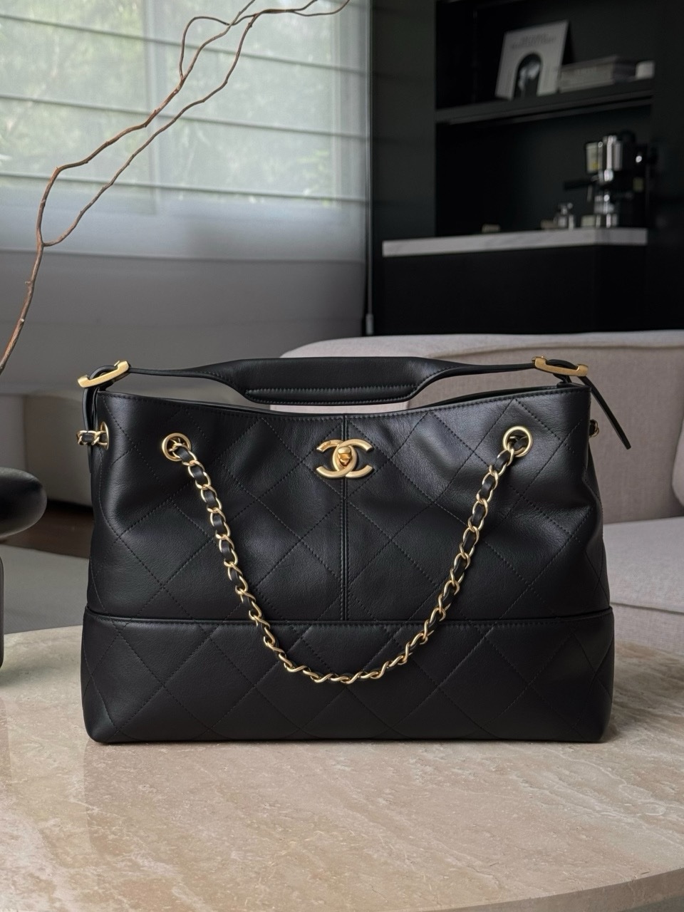 Chanel 25a Hobo Bag in classic black calfskin with gold-tone metal hardware. Size 24x36x14cm
