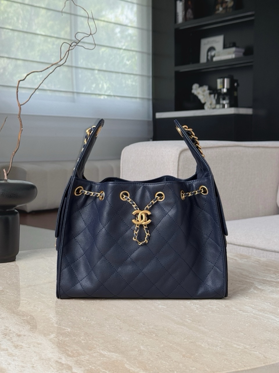 Chanel 25 small hobo bag in dark navy caviar leather with antique gold-tone hardware Size 30x26x14cm