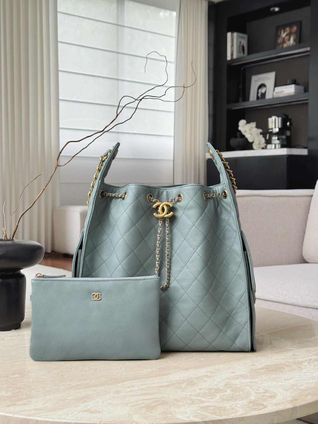 Chanel 25 hobo bag in light blue or haze blue caviar leather with antique aged gold-tone metal hardware Medium Size 30x40x15cm