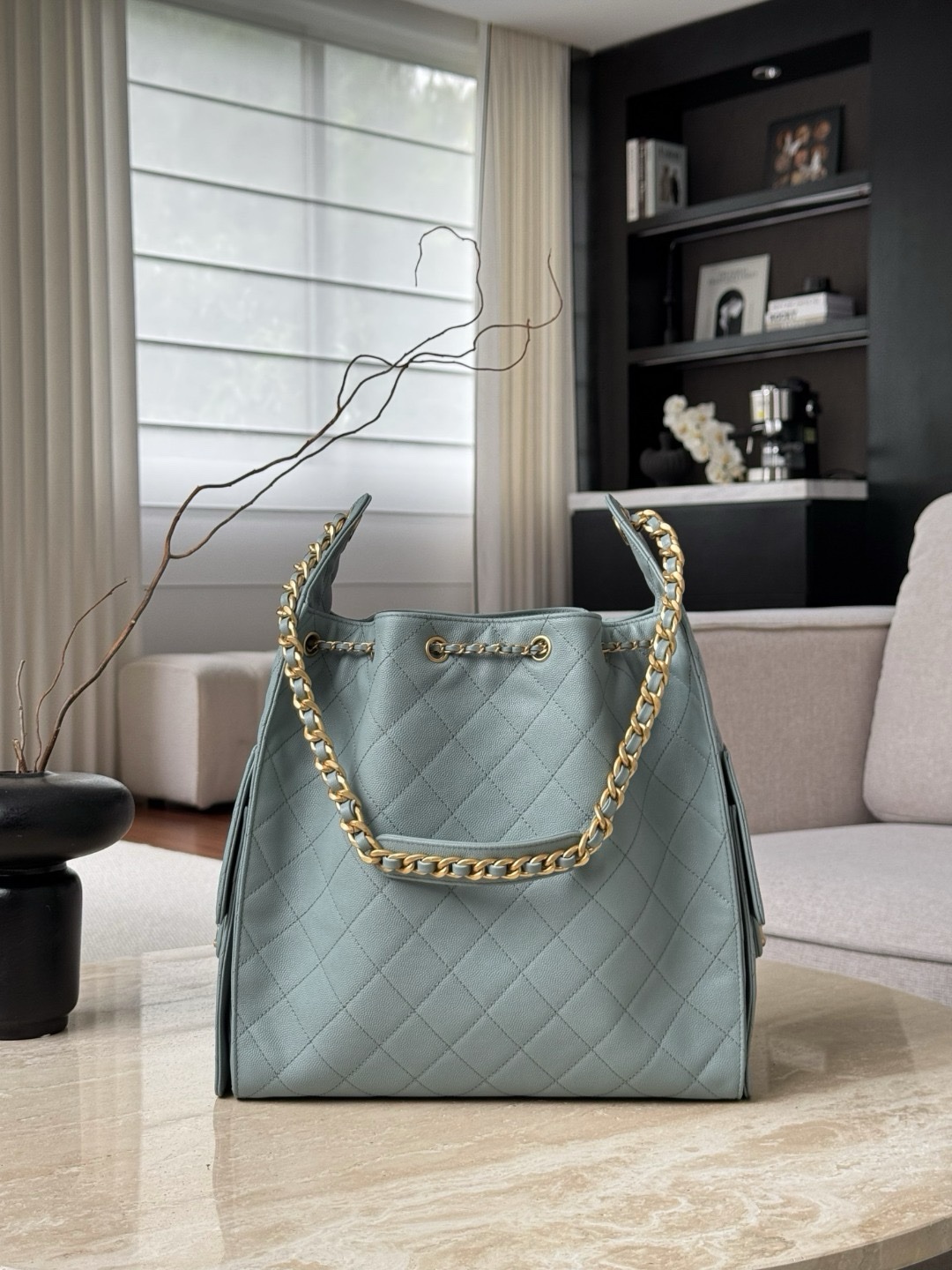 Chanel 25 small hobo bag in a light blue or green caviar leather with aged gold hardware Medium Size 30x40x15cm