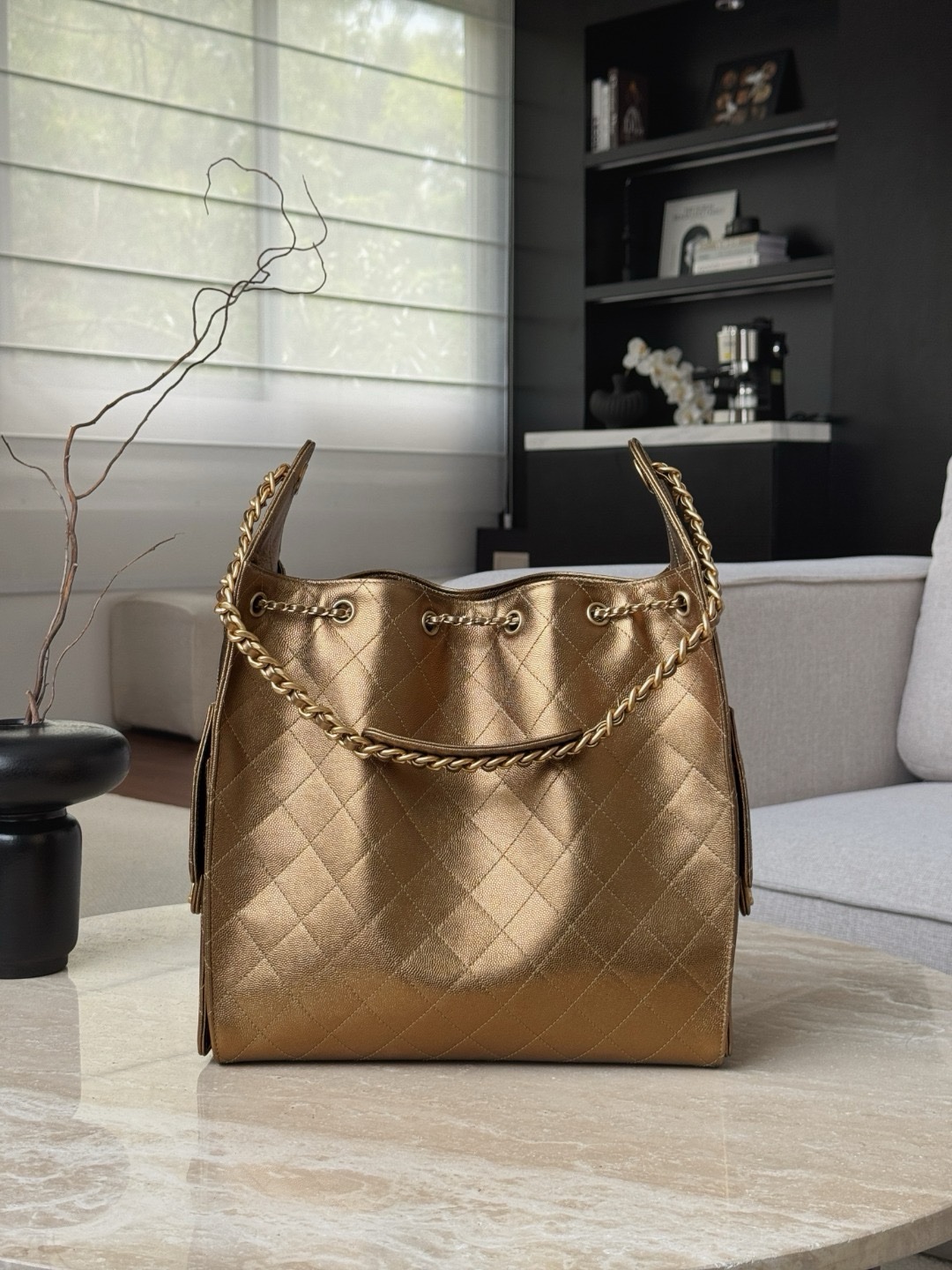 Chanel 25 small hobo bag in a golden metallic color with gold-tone metal hardware.  30x40x15cm