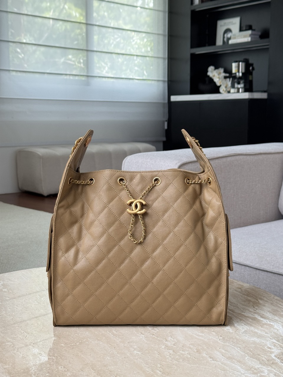 Chanel 25 hobo bag in dark beige caviar leather with antique gold-tone hardware.  30x40x15cm