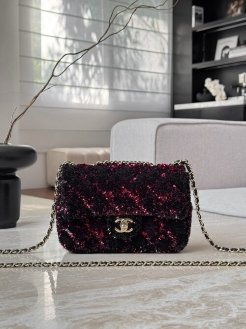 Chanel Flap Bag in a black and red sequin material.  14x21x8cm