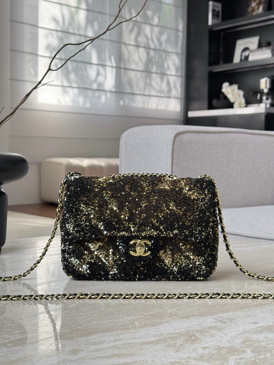 Chanel Flap Bag in black sequins with gold-tone metal hardware.  14x21x8cm