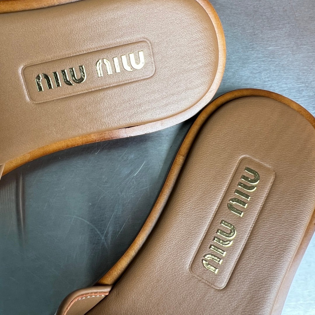 Miu Miu canvas and leather slides in beige/brandy