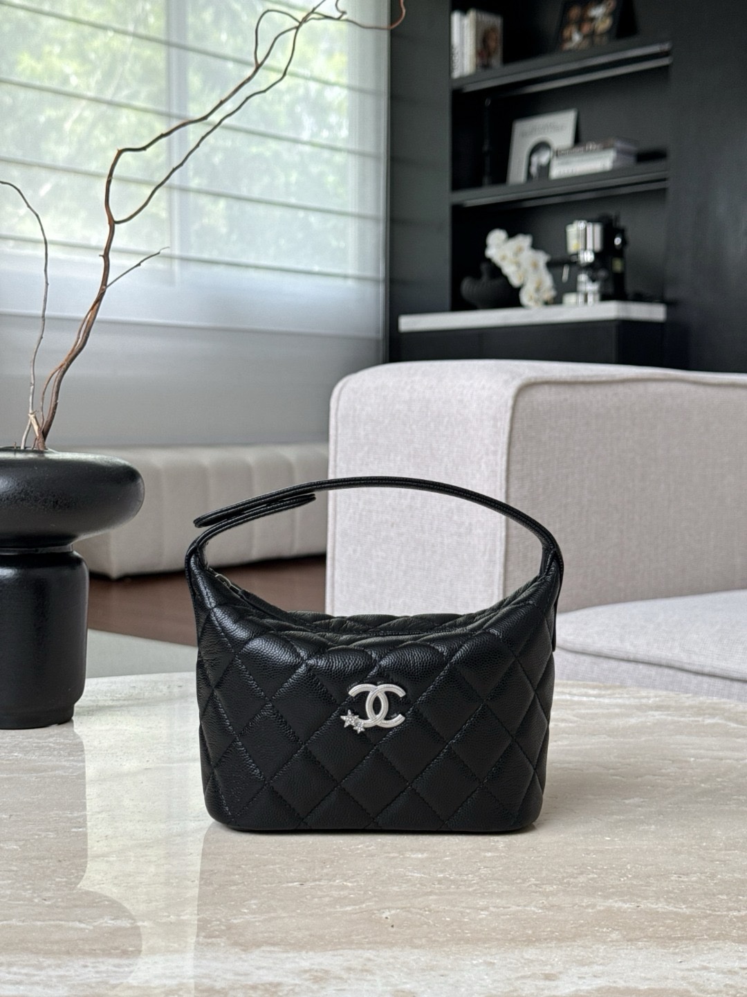 Chanel 25 Hobo bag in quilted caviar leather with a silver-tone metal interlocking CC logo.  21.5x19x7.5cm
