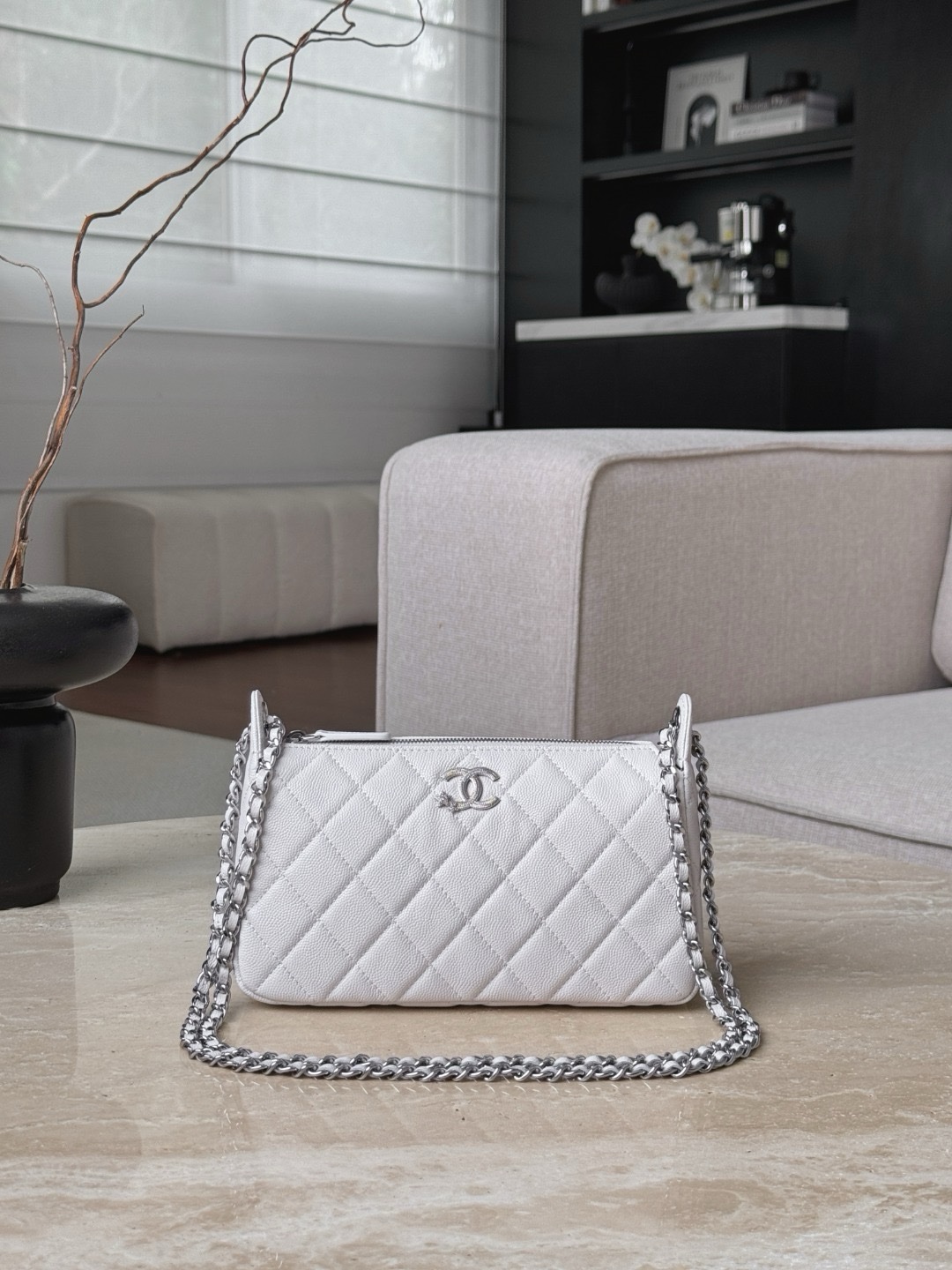 Chanel classic small pouch in caviar leather with silver-tone hardware.  21x14x5.5cm