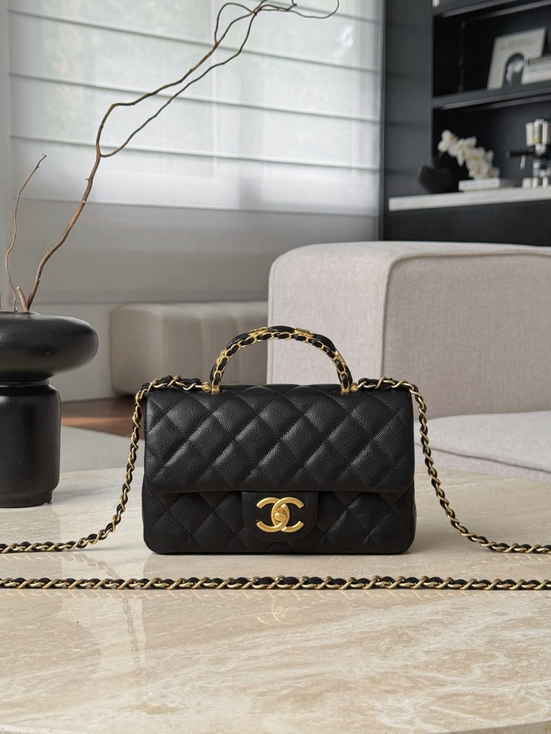 Chanel Caviar Quilted Mini Handy CC Flap bag in black leather with gold-plated hardware.  12×19.5×6.5cm