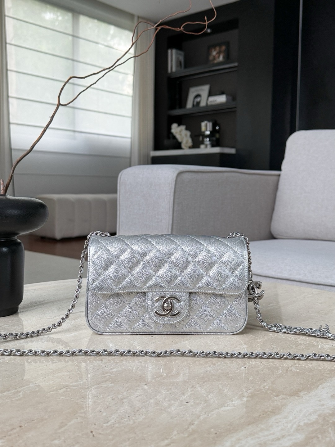 Chanel Mini Classic Flap Bag in iridescent silver caviar leather with silver hardware.  13x20x7cm