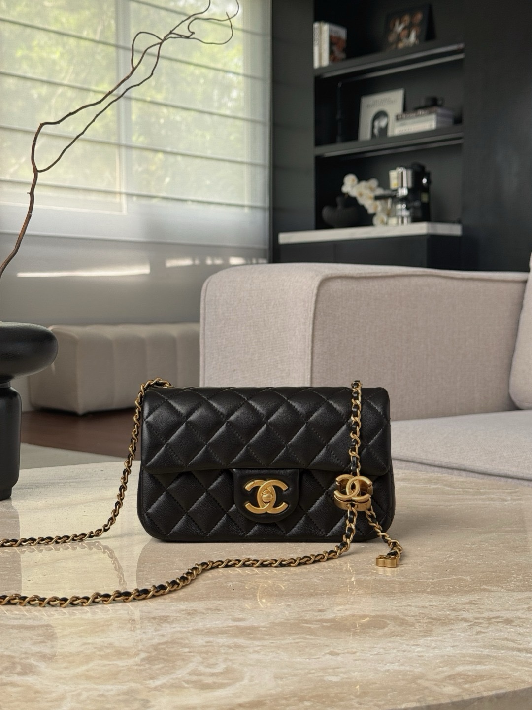 Chanel Classic Flap Bag in black lambskin leather with gold hardware.  13x20x7cm