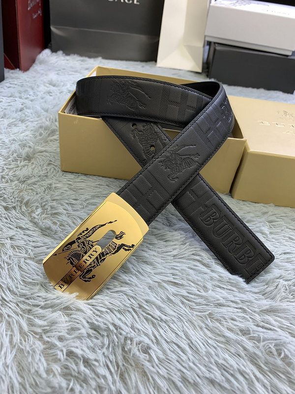 Burberry men's black leather belt with a gold-tone Equestrian Knight Design buckle.