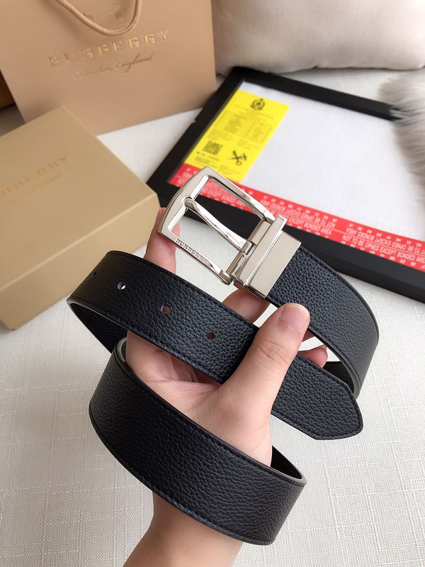 Burberry B Buckle 35mm adjustable and reversible black embossed leather belt with a silver-tone metal B buckle.