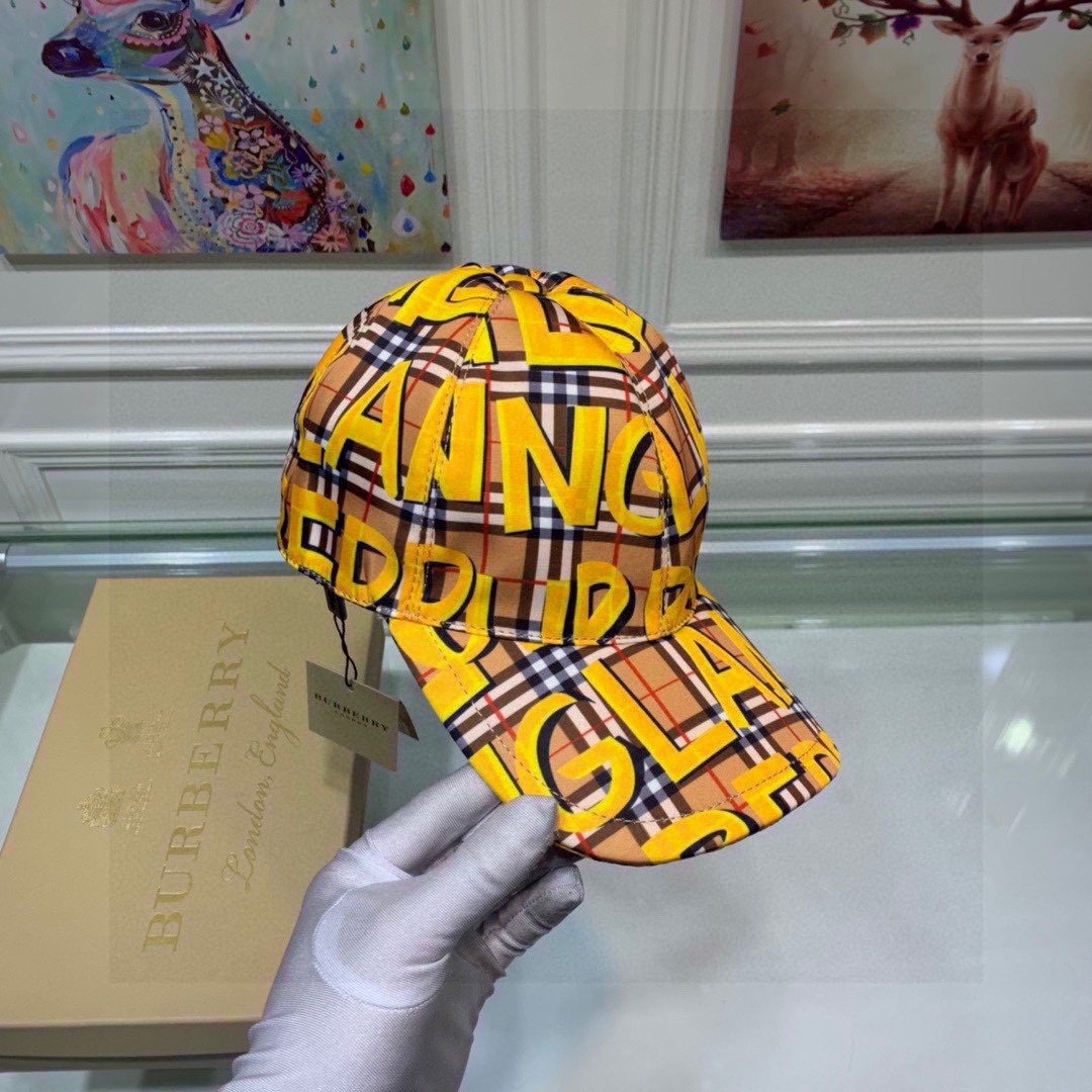 Burberry baseball cap in the brand's signature check pattern with yellow graffiti-style lettering