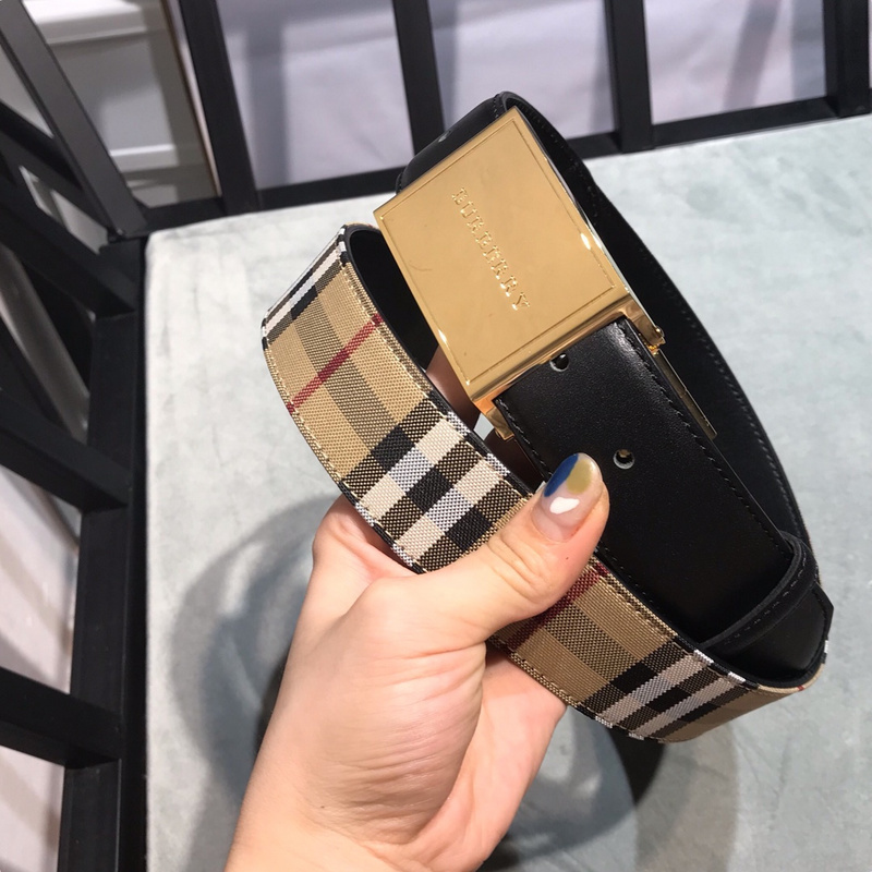 Burberry Check B Buckle belt in a cotton blend with a gold-plated brass B buckle and calf leather lining.