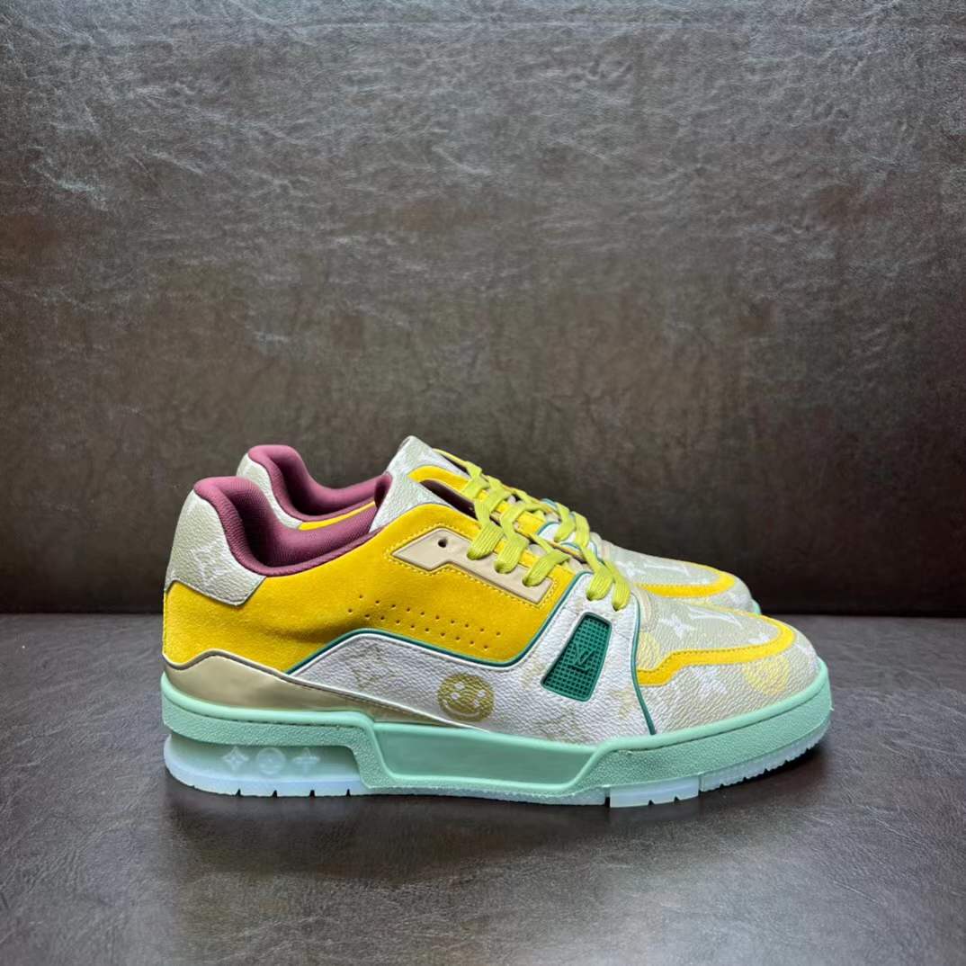 LV Trainer sneaker in a yellow, green, and white colorway with the signature Monogram pattern
