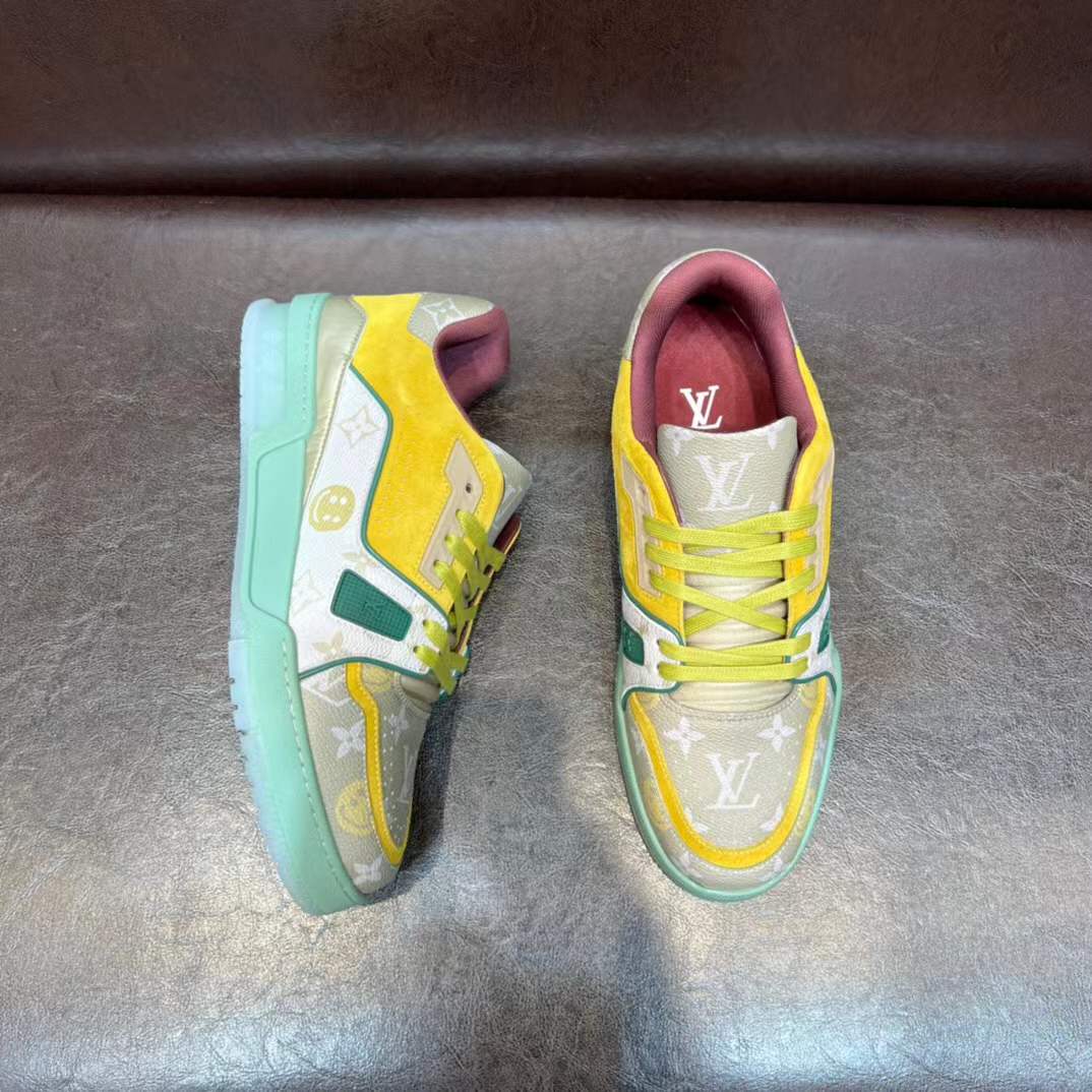 LV Trainer sneaker in a yellow, green, and white colorway with the signature Monogram pattern