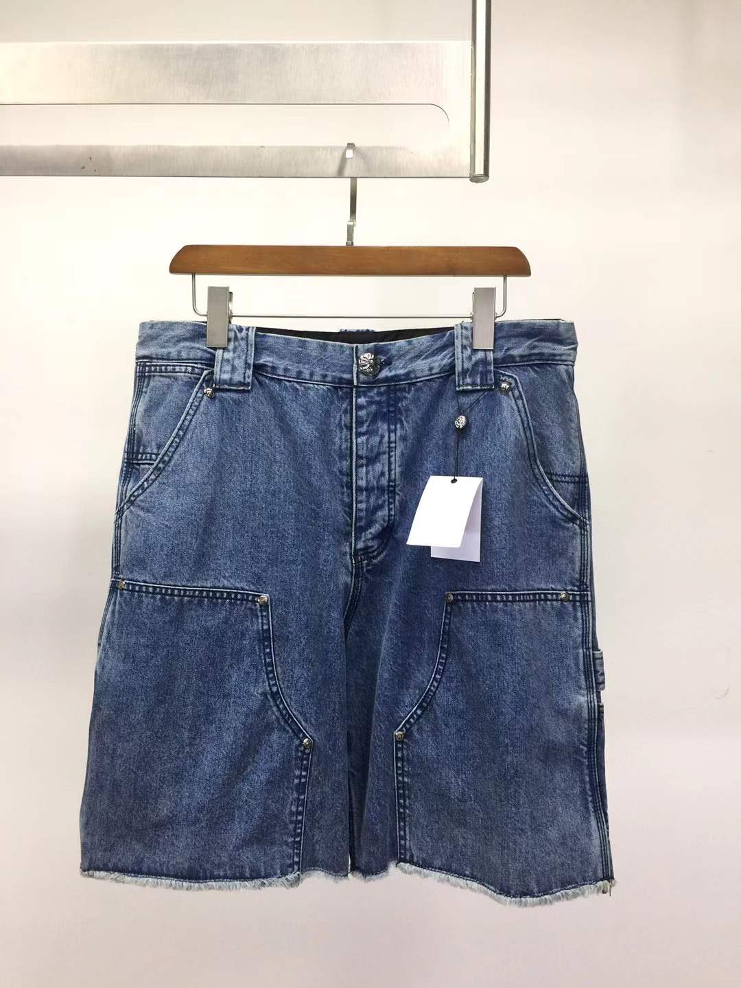 Chrome Hearts denim carpenter shorts with silver buttons and rivets