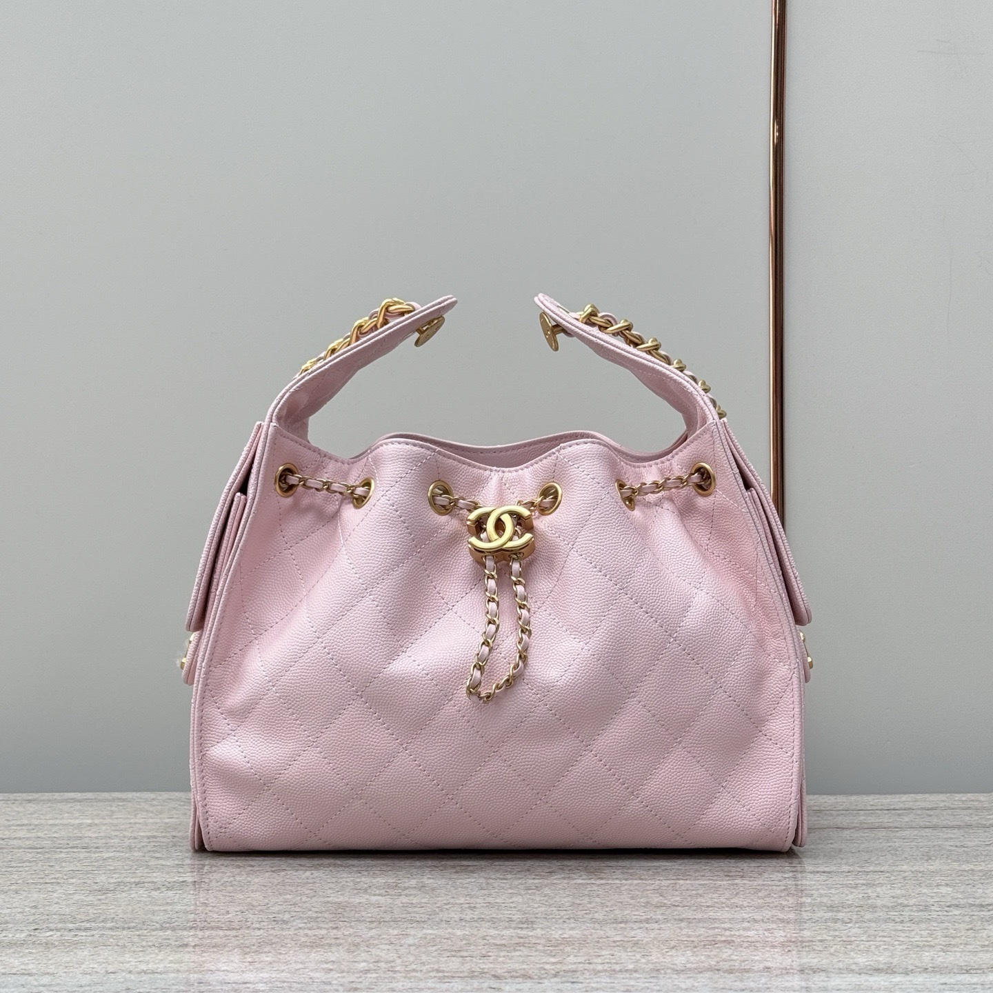 Chanel Code 10308 25S Medium Hobo handbag in light pink grained calfskin leather with gold-tone metal hardware Size 26x30x14cm