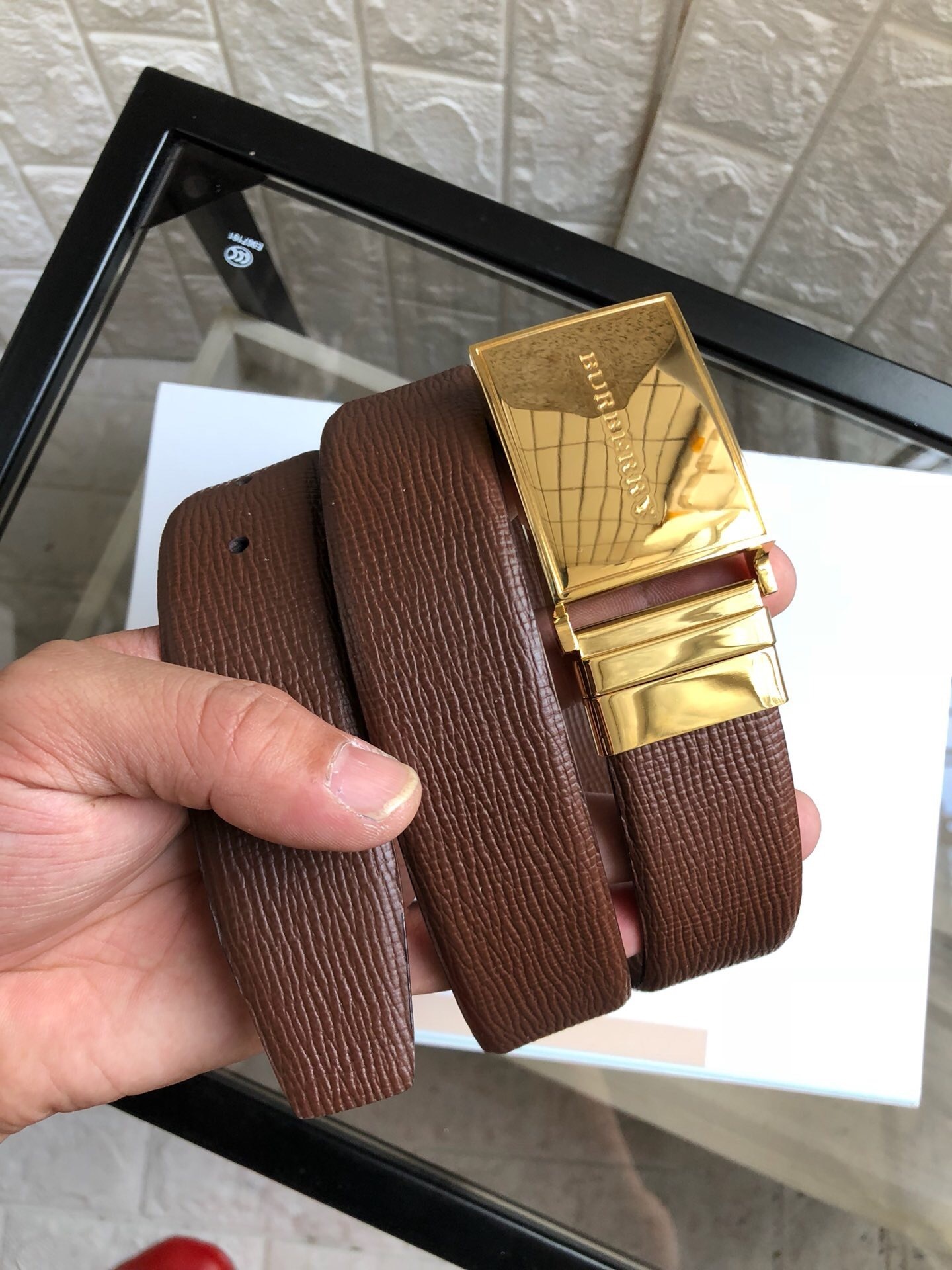 Burberry brown leather belt with a gold-tone buckle