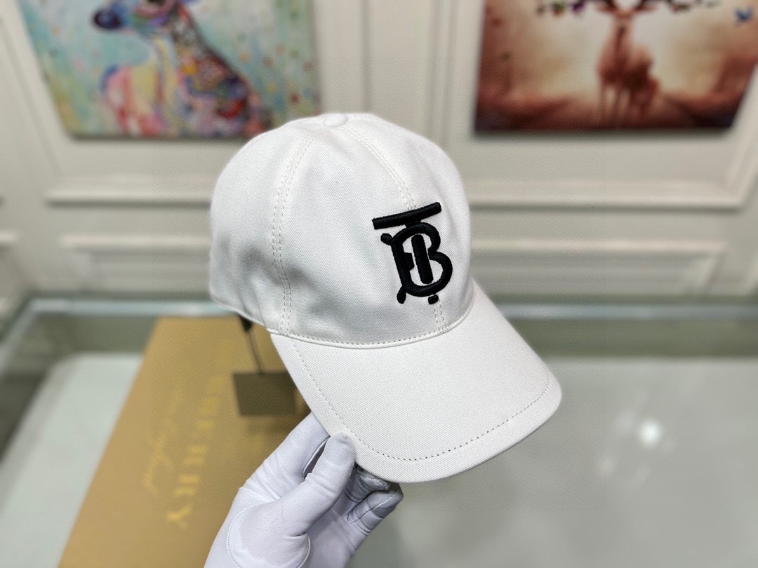 Burberry Logo Gabardine Baseball Cap with an embroidered Thomas Burberry "TB" monogram logo