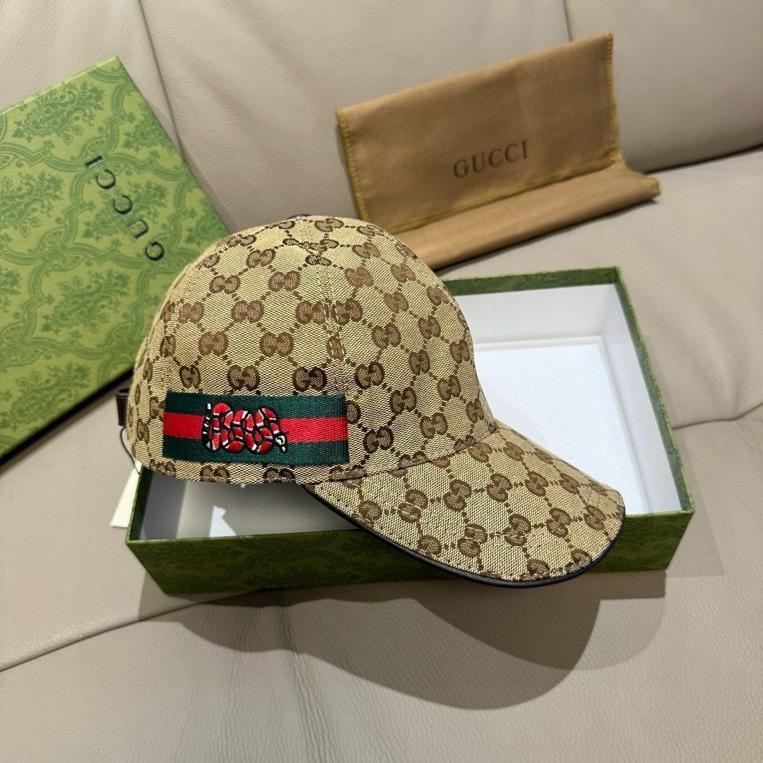 Gucci GG canvas baseball hat with a Web and snake detail in beige and dark brown.