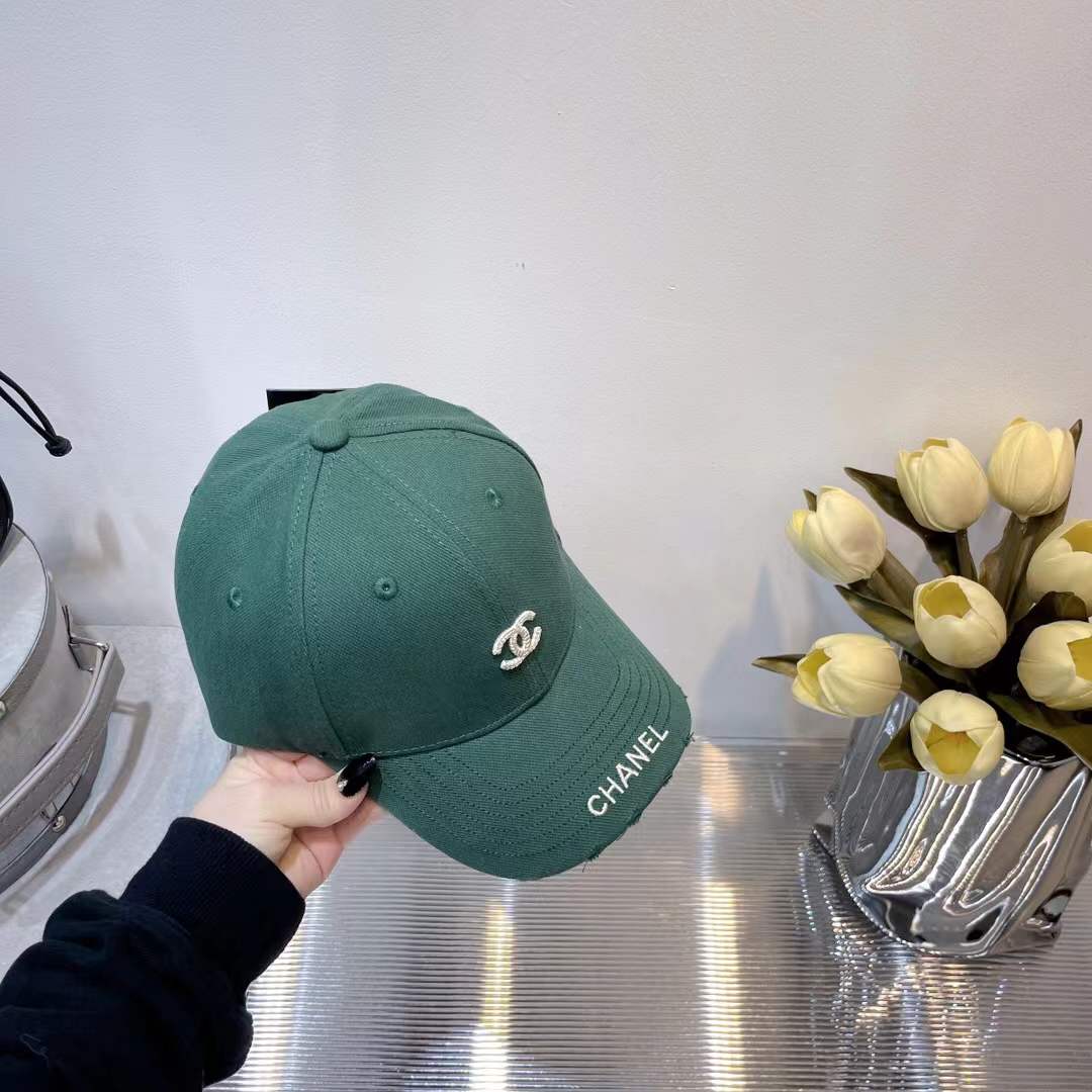 Chanel baseball cap green with a CC logo.