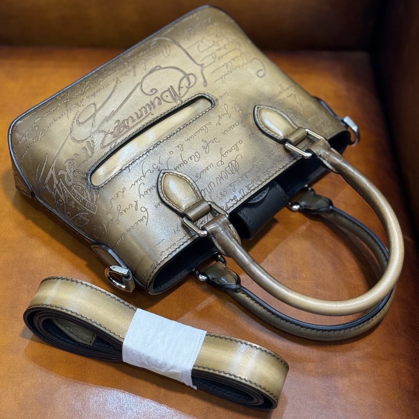 Berluti Toujours Gulliver handbag in Venezia leather with a Scritto (calligraphy) design