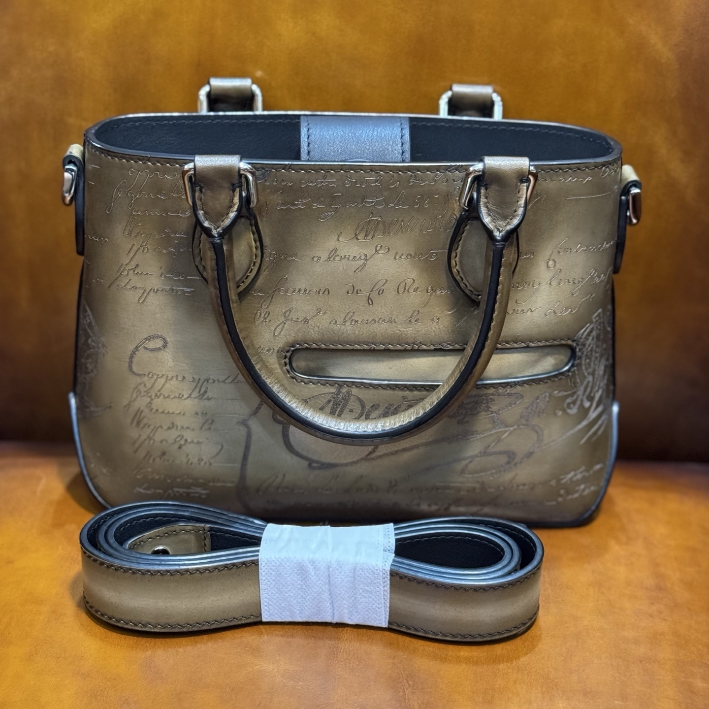 Berluti Toujours Gulliver handbag in Venezia leather with a Scritto (calligraphy) design