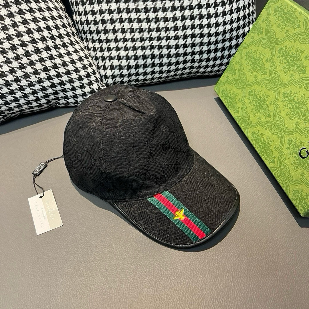 Gucci Original GG canvas baseball hat with a black base, black leather detail, and signature green and red Web stripe