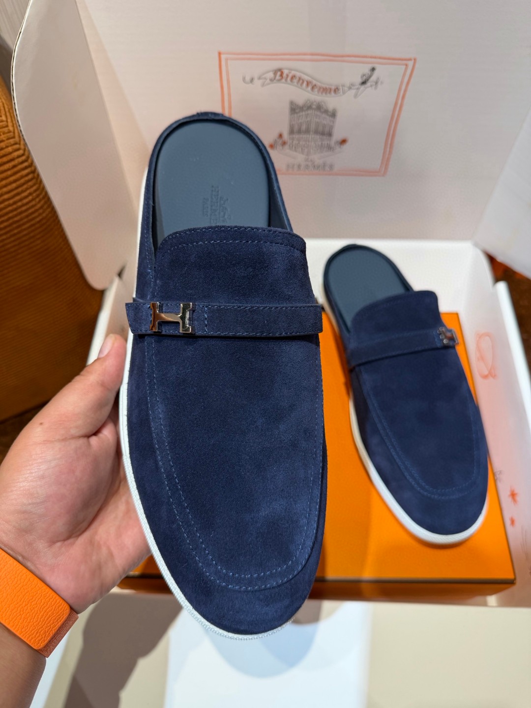 Hermès Likely mules in marine blue suede calfskin with a rubber sole