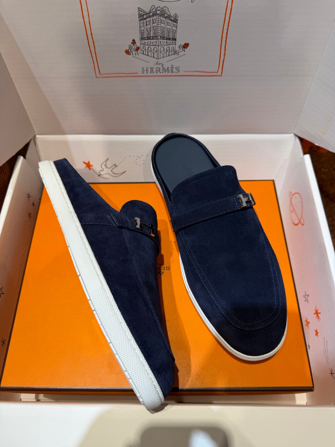 Hermès Likely mules in marine blue suede calfskin with a rubber sole
