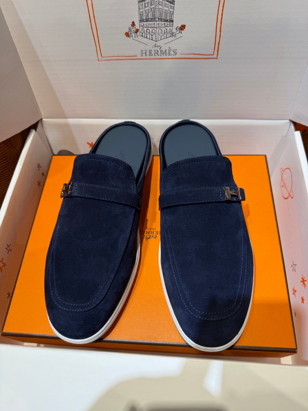 Hermès Likely mules in marine blue suede calfskin with a rubber sole