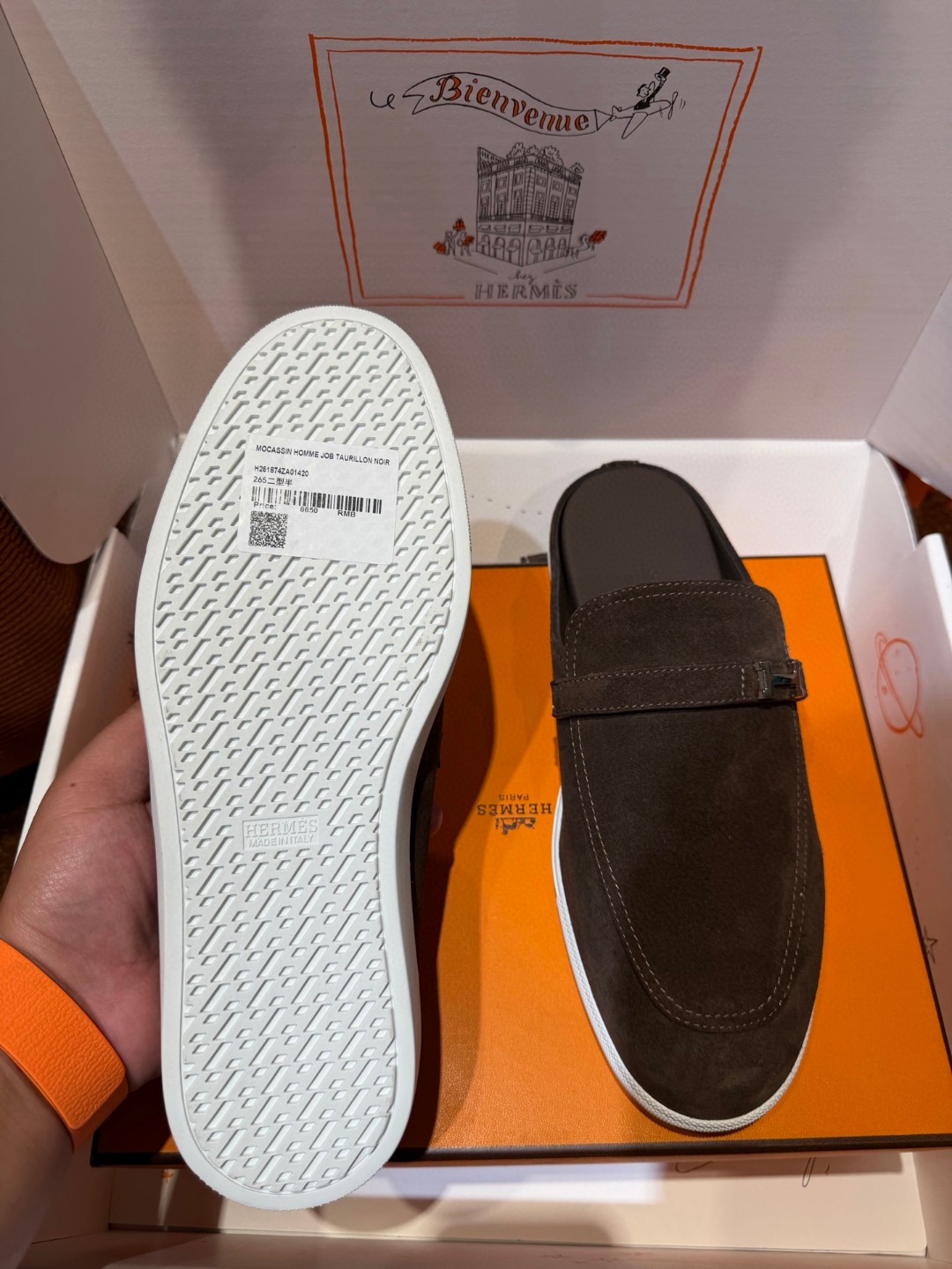 Hermès Likely mule in Écorce brown suede with a palladium-plated H buckle and rubber sole