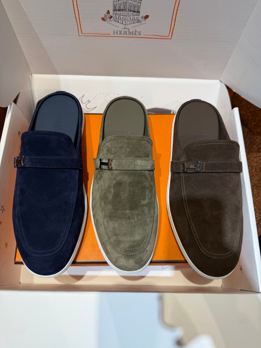 Hermès Likely mule in Écorce brown suede with a palladium-plated H buckle and rubber sole