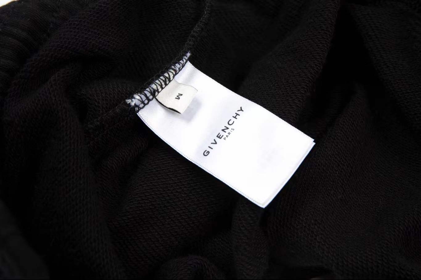 Givenchy black cotton logo-print track shorts with a drawstring waist and two side slit pockets