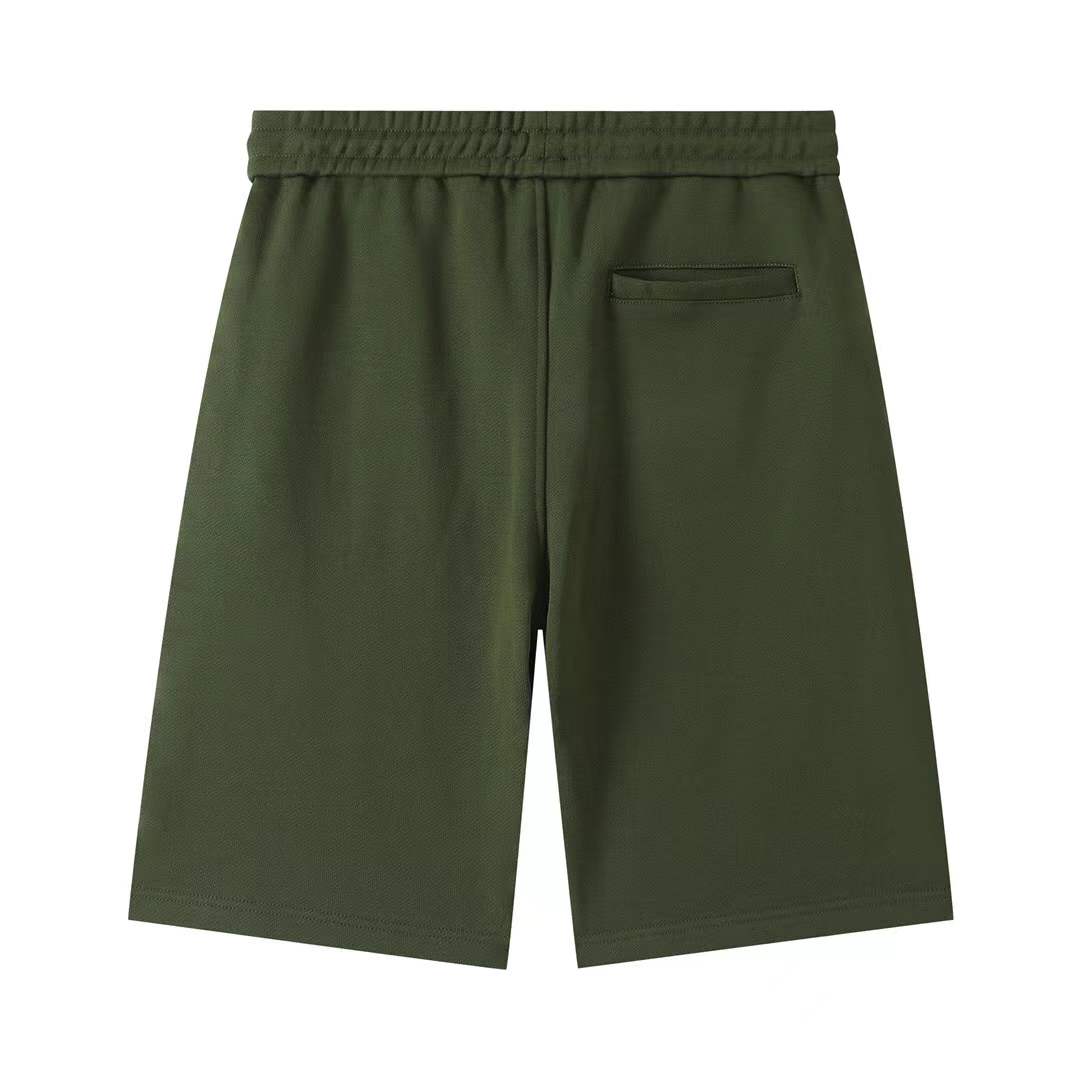 Fendi men's green shorts with a Monster Eyes motif.