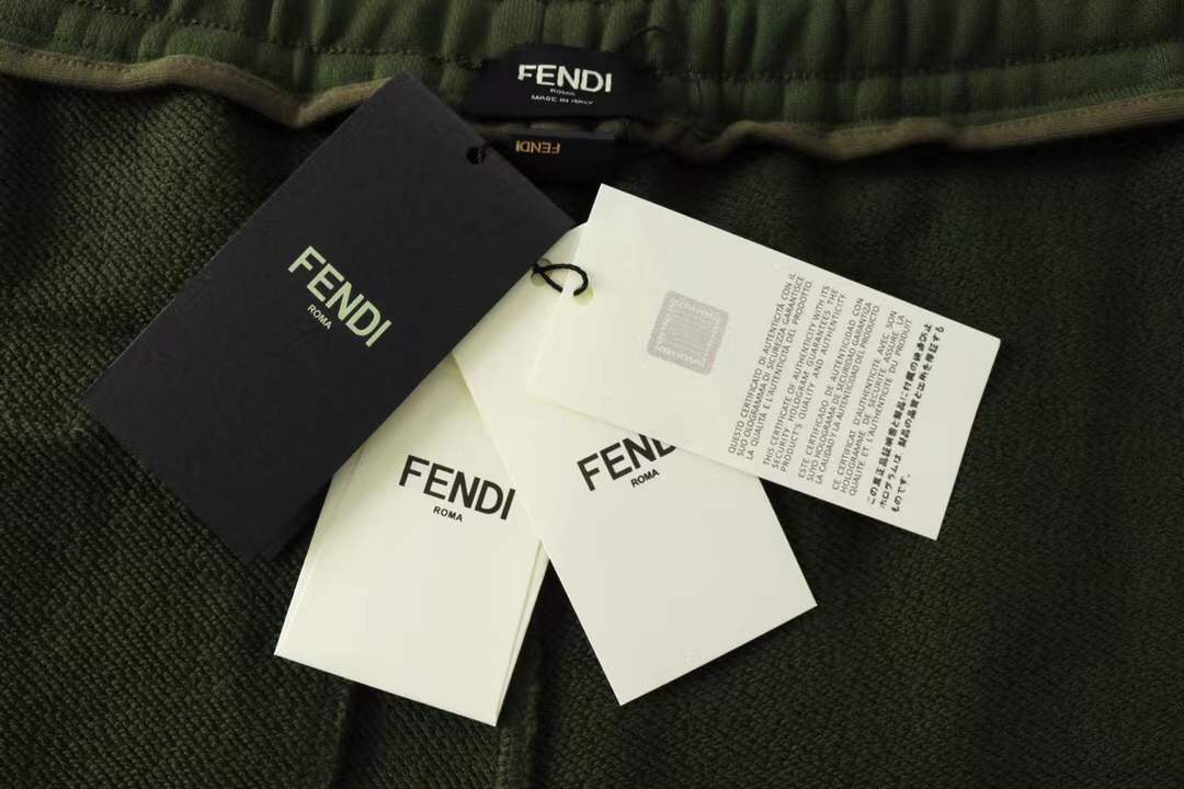 Fendi men's green shorts with a Monster Eyes motif.