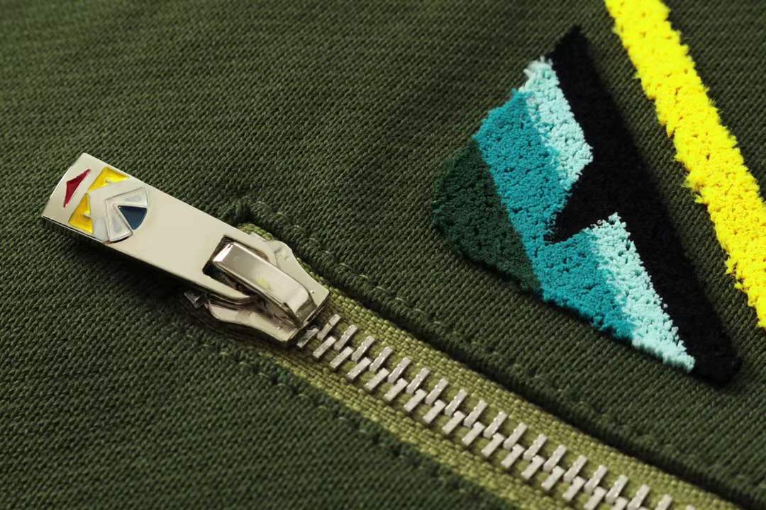 Fendi men's green shorts with a Monster Eyes motif.