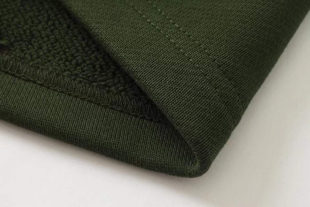 Fendi men's green shorts with a Monster Eyes motif.