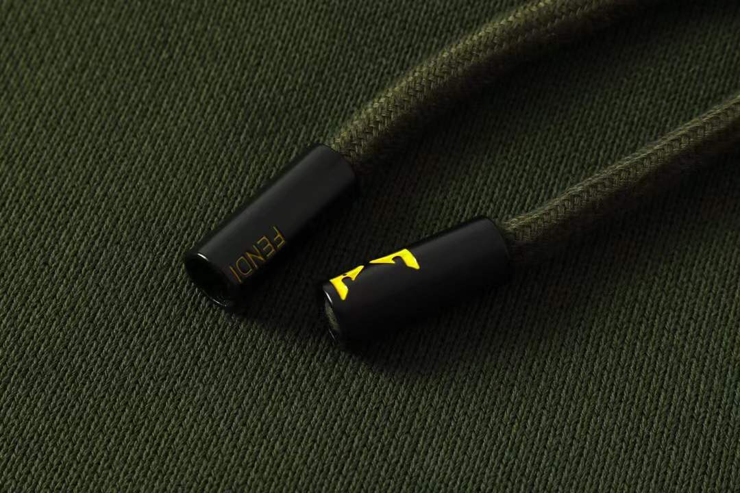 Fendi men's green shorts with a Monster Eyes motif.