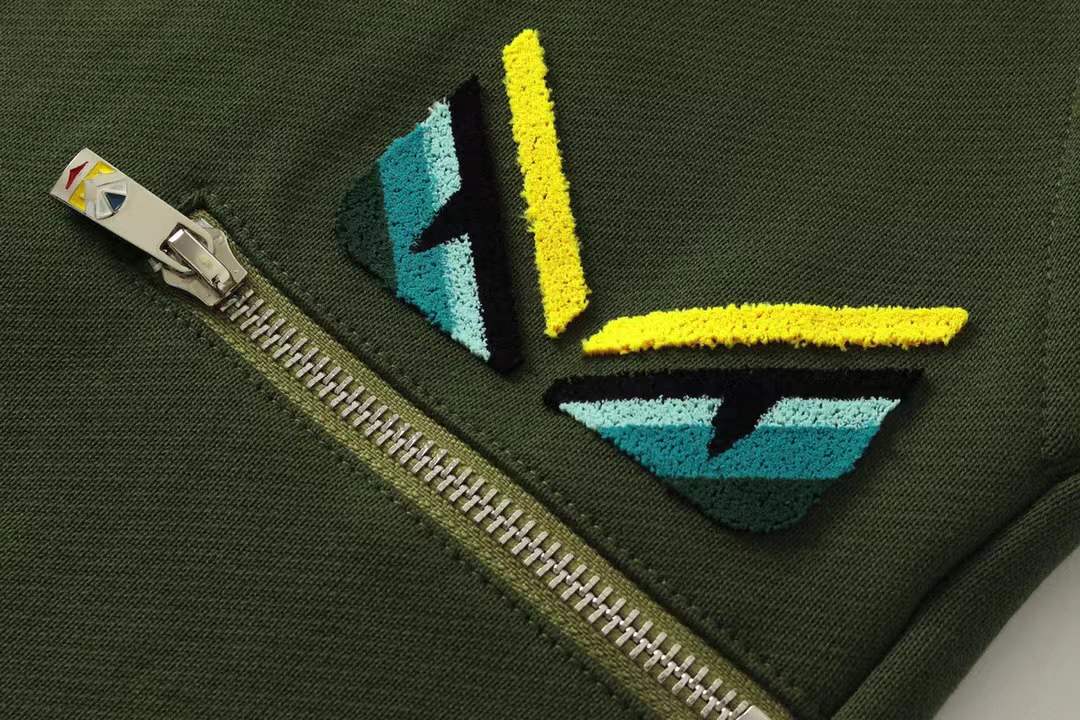 Fendi men's green shorts with a Monster Eyes motif.