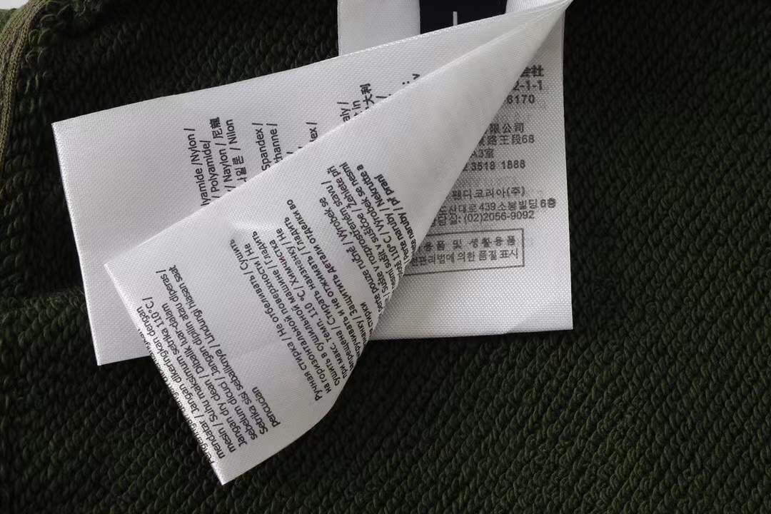 Fendi men's green shorts with a Monster Eyes motif.