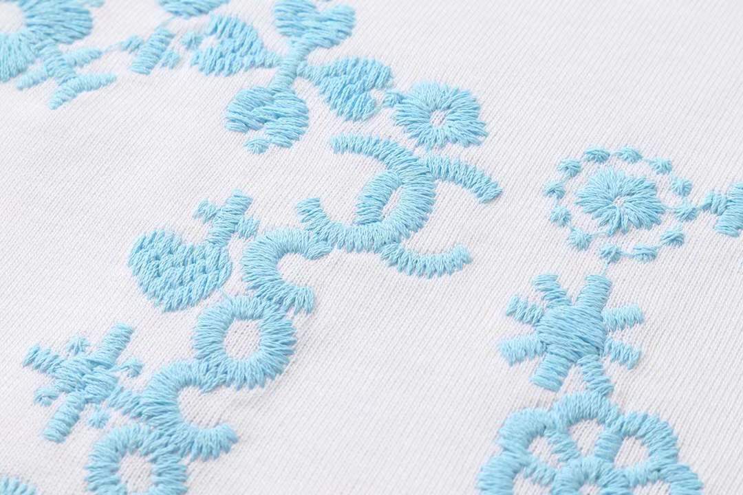 chanel t-shirt with a blue floral logo